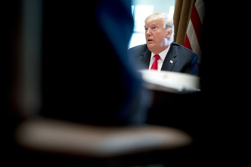Trump warns he'll revoke clearance of Justice Dept official