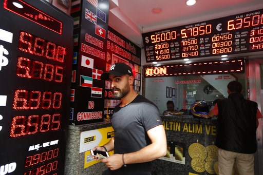 The Latest: Moody's cuts Turkey's credit rating further