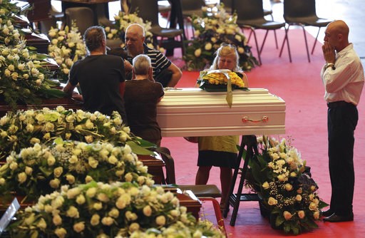 The Latest: Romanian trucker is Genoa bridge's 43rd victim