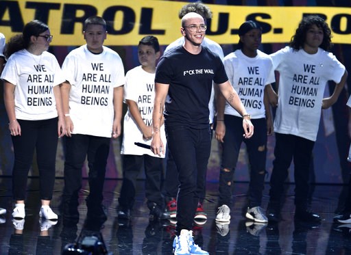 Logic stages immigrant protest at VMAs with parents, kids