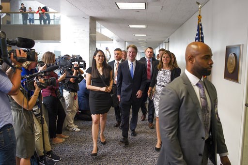 The Latest: Dem: Court pick won't say if rulings are correct