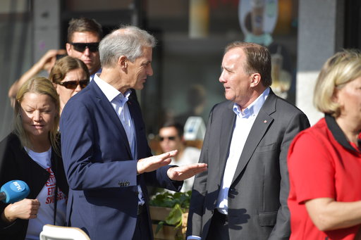 (Jessica Gow/TT via AP). Stefan Lofven, leader of the Social Democratic Party, right, speaks to his Norwegian counterpart Jonas Gahr Store during an campaign rally in central Stockholm, Sweden, Saturday Sept. 8, 2018. Swedish political candidates are m...