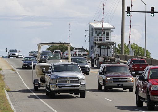 (AP Photo/Chuck Burton). People drive over a drawbridge in Wrightsville Beach, N.C., as they evacuate the area in advance of Hurricane Florence, Tuesday, Sept. 11, 2018. Florence exploded into a potentially catastrophic hurricane Monday as it closed in... (AP Photo/Chuck Burton). People drive over a drawbridge in Wrightsville Beach, N.C., as they evacuate the area in advance of Hurricane Florence, Tuesday, Sept. 11, 2018. Florence exploded into a potentially catastrophic hurricane Monday as it closed in...