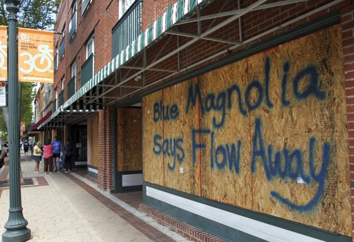 (Gray Whitley/Sun Journal via AP). Storefronts have wood paneling installed over windows, Tuesday, Sept. 11, 2018, in New Bern, N.C., as a precaution against storm damage from Hurricane Florence. (Gray Whitley/Sun Journal via AP). Storefronts have wood paneling installed over windows, Tuesday, Sept. 11, 2018, in New Bern, N.C., as a precaution against storm damage from Hurricane Florence.