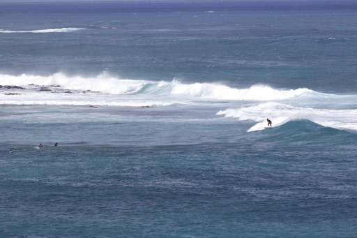 (AP Photo/Caleb Jones). A surfer rides a wave as Tropical Storm Olivia approaches the islands, Tuesday, Sept. 11, 2018, near Honolulu. The National Weather Service says the storm could dump as much as 20 inches of rain on some parts of the state as it ... (AP Photo/Caleb Jones). A surfer rides a wave as Tropical Storm Olivia approaches the islands, Tuesday, Sept. 11, 2018, near Honolulu. The National Weather Service says the storm could dump as much as 20 inches of rain on some parts of the state as it ...