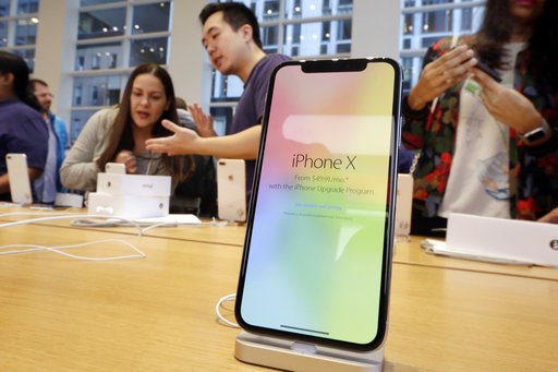 (AP Photo/Richard Drew, File). FILE - In this Nov. 3, 2017, file photo, customers buy the iPhone X at the Apple Store on New York's Fifth Avenue. Apple is expected to unveil its biggest and most expensive iPhone on Wednesday, Sept. 12, 2018, as part of... (AP Photo/Richard Drew, File). FILE - In this Nov. 3, 2017, file photo, customers buy the iPhone X at the Apple Store on New York's Fifth Avenue. Apple is expected to unveil its biggest and most expensive iPhone on Wednesday, Sept. 12, 2018, as part of...