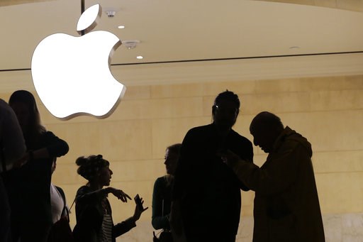 (AP Photo/Mark Lennihan, File). FILE- In this May 31, 2018, file photo customers enter the Apple store in New York. Apple is expected to unveil its biggest and most expensive iPhone yet on Wednesday, Sept. 12, along with two smaller, cheaper versions i... (AP Photo/Mark Lennihan, File). FILE- In this May 31, 2018, file photo customers enter the Apple store in New York. Apple is expected to unveil its biggest and most expensive iPhone yet on Wednesday, Sept. 12, along with two smaller, cheaper versions i...
