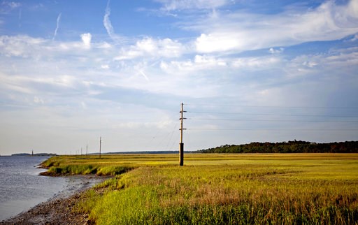 (AP Photo/David Goldman, File). FILE - In this May 16, 2013, file photo, a utility pole stands in the middle of a marsh at sunset on Sapelo Island, Ga., a Gullah-Geechee community. A tight-knit community of slave descendants on the South Carolina coast... (AP Photo/David Goldman, File). FILE - In this May 16, 2013, file photo, a utility pole stands in the middle of a marsh at sunset on Sapelo Island, Ga., a Gullah-Geechee community. A tight-knit community of slave descendants on the South Carolina coast...