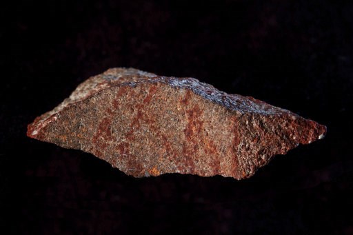 (Craig Foster via AP). This undated photo provided by Craig Foster in September 2018 shows a drawing made with ochre pigment on silcrete stone, found in the Blombos Cave east of Cape Town, South Africa. In a report released on Wednesday, Sept. 12, 2018... (Craig Foster via AP). This undated photo provided by Craig Foster in September 2018 shows a drawing made with ochre pigment on silcrete stone, found in the Blombos Cave east of Cape Town, South Africa. In a report released on Wednesday, Sept. 12, 2018...