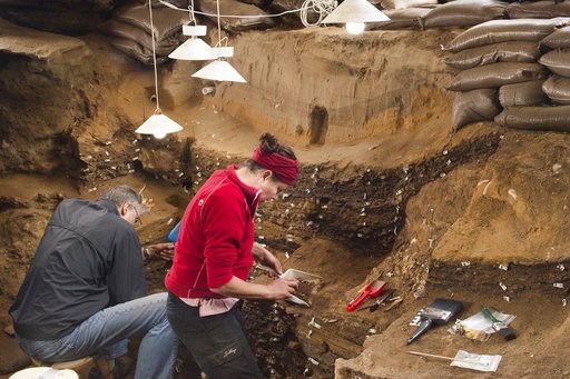(Magnus M. Haaland via AP). This undated photo provided by Magnus M. Haaland in September 2018 shows researchers in the interior of the Blombos Cave east of Cape Town, South Africa. In a report released on Wednesday, Sept. 12, 2018, scientists say a ti... (Magnus M. Haaland via AP). This undated photo provided by Magnus M. Haaland in September 2018 shows researchers in the interior of the Blombos Cave east of Cape Town, South Africa. In a report released on Wednesday, Sept. 12, 2018, scientists say a ti...