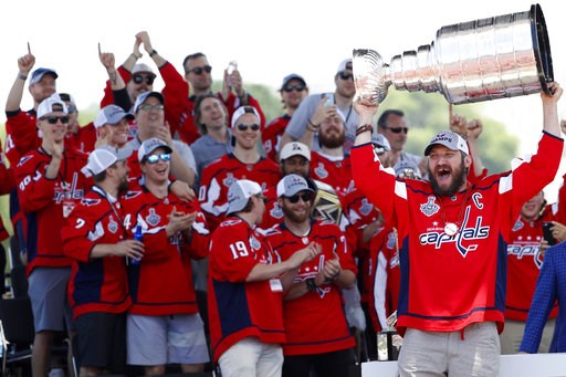 (AP Photo/Jacquelyn Martin, File). FILE - In this June 12, 2018, file photo, Washington Capitals' Alex Ovechkin, from Russia, right, holds up the Stanley Cup during a victory rally in Washington. The celebrating is over for now for the Capitals after p... (AP Photo/Jacquelyn Martin, File). FILE - In this June 12, 2018, file photo, Washington Capitals' Alex Ovechkin, from Russia, right, holds up the Stanley Cup during a victory rally in Washington. The celebrating is over for now for the Capitals after p...