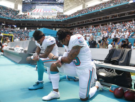 (AP Photo/Wilfredo Lee). Miami Dolphins wide receiver Kenny Stills (10) and Miami Dolphins wide receiver Albert Wilson (15) kneel during the national anthem before an NFL football game against the Tennessee Titans, Sunday, Sept. 9, 2018, in Miami Garde... (AP Photo/Wilfredo Lee). Miami Dolphins wide receiver Kenny Stills (10) and Miami Dolphins wide receiver Albert Wilson (15) kneel during the national anthem before an NFL football game against the Tennessee Titans, Sunday, Sept. 9, 2018, in Miami Garde...