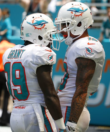 (AP Photo/Wilfredo Lee). Miami Dolphins wide receiver Jakeem Grant (19) celebrates with wide receiver Kenny Stills (10) after Stills scored a touchdown, during the first half of an NFL football game against the Tennessee Titans, Sunday, Sept. 9, 2018, ... (AP Photo/Wilfredo Lee). Miami Dolphins wide receiver Jakeem Grant (19) celebrates with wide receiver Kenny Stills (10) after Stills scored a touchdown, during the first half of an NFL football game against the Tennessee Titans, Sunday, Sept. 9, 2018, ...