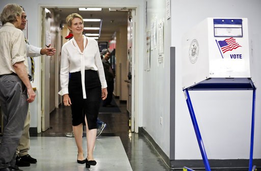 (AP Photo/Bebeto Matthews). Polling station officials direct New York gubernatorial candidate Cynthia Nixon to her voting area for the primary, Thursday, Sept. 13, 2018, in New York. Democrats across New York state are picking the winner of a long and ... (AP Photo/Bebeto Matthews). Polling station officials direct New York gubernatorial candidate Cynthia Nixon to her voting area for the primary, Thursday, Sept. 13, 2018, in New York. Democrats across New York state are picking the winner of a long and ...