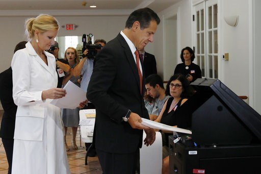 (AP Photo/Richard Drew). New York Gov. Andrew Cuomo, accompanied by his girlfriend Sandra Lee, puts his primary election ballot in a scanner at the Presbyterian Church of Mount Kisco, in Mt. Kisco, NY, Thursday, Sept. 13, 2018. (AP Photo/Richard Drew). New York Gov. Andrew Cuomo, accompanied by his girlfriend Sandra Lee, puts his primary election ballot in a scanner at the Presbyterian Church of Mount Kisco, in Mt. Kisco, NY, Thursday, Sept. 13, 2018.