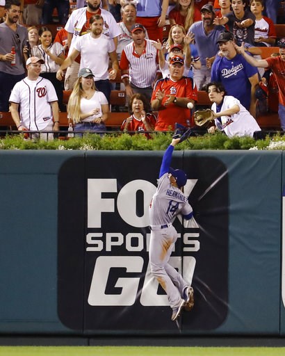 (AP Photo/Billy Hurst). Los Angeles Dodgers center fielder Enrique Hernandez cannot catch a home run hit by St. Louis Cardinals' Tyson Ross during the fifth inning of a baseball game Thursday, Sept. 13, 2018, in St. Louis. (AP Photo/Billy Hurst). Los Angeles Dodgers center fielder Enrique Hernandez cannot catch a home run hit by St. Louis Cardinals' Tyson Ross during the fifth inning of a baseball game Thursday, Sept. 13, 2018, in St. Louis.
