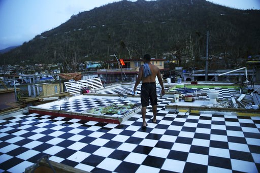 (AP Photo/Gerald Herbert, File). FILE - In this Sept. 26, 2017 file photo, Nestor Serrano walks on the upstairs floor of his home, where the walls were blown off, in the aftermath of Hurricane Maria, in Yabucoa, Puerto Rico. President Donald Trump's as... (AP Photo/Gerald Herbert, File). FILE - In this Sept. 26, 2017 file photo, Nestor Serrano walks on the upstairs floor of his home, where the walls were blown off, in the aftermath of Hurricane Maria, in Yabucoa, Puerto Rico. President Donald Trump's as...
