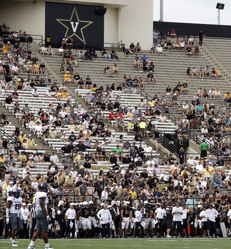 (AP Photo/Mark Humphrey, File). FILE - In this Saturday, Sept. 8, 2018, file photo, fans sit in the stands at Vanderbilt Stadium during the second half of an NCAA college football game between Vanderbilt and Nevada in Nashville, Tenn. It will be a Virg... (AP Photo/Mark Humphrey, File). FILE - In this Saturday, Sept. 8, 2018, file photo, fans sit in the stands at Vanderbilt Stadium during the second half of an NCAA college football game between Vanderbilt and Nevada in Nashville, Tenn. It will be a Virg...