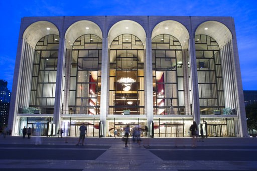 (AP Poto/John Minchillo, File). FILE - In this Aug. 1, 2014, file photo, pedestrians make their way in front of the Metropolitan Opera house at New York's Lincoln Center. The Metropolitan Opera will start regular Sunday afternoon performances for the f... (AP Poto/John Minchillo, File). FILE - In this Aug. 1, 2014, file photo, pedestrians make their way in front of the Metropolitan Opera house at New York's Lincoln Center. The Metropolitan Opera will start regular Sunday afternoon performances for the f...