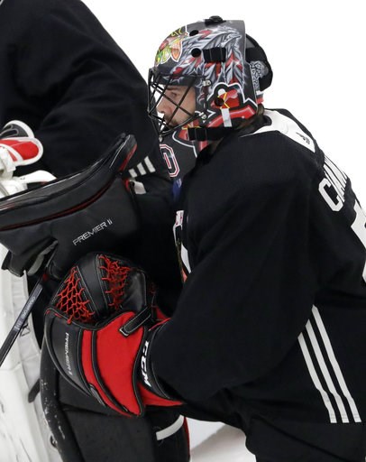 (AP Photo/Nam Y. Huh). Chicago Blackhawks goalie Corey Crawford listens to a coach during NHL hockey training camp at the MB Ice Arena, Friday, Sept. 14, 2018, in Chicago. (AP Photo/Nam Y. Huh). Chicago Blackhawks goalie Corey Crawford listens to a coach during NHL hockey training camp at the MB Ice Arena, Friday, Sept. 14, 2018, in Chicago.