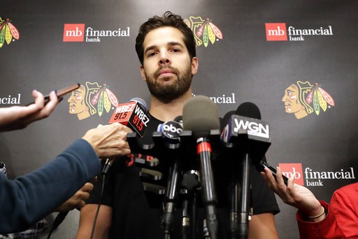 (AP Photo/Nam Y. Huh). Chicago Blackhawks goalie Corey Crawford listens to questions after NHL hockey training camp at the MB Ice Arena, Friday, Sept. 14, 2018, in Chicago. (AP Photo/Nam Y. Huh). Chicago Blackhawks goalie Corey Crawford listens to questions after NHL hockey training camp at the MB Ice Arena, Friday, Sept. 14, 2018, in Chicago.