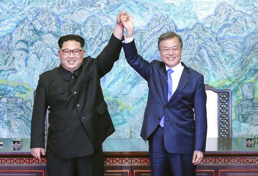 (Korea Summit Press Pool via AP, File). FILE - In this April 27, 2018 file photo, North Korean leader Kim Jong Un, left, and South Korean President Moon Jae-in raise their hands after signing a joint statement at the border village of Panmunjom in the ... (Korea Summit Press Pool via AP, File). FILE - In this April 27, 2018 file photo, North Korean leader Kim Jong Un, left, and South Korean President Moon Jae-in raise their hands after signing a joint statement at the border village of Panmunjom in the ...