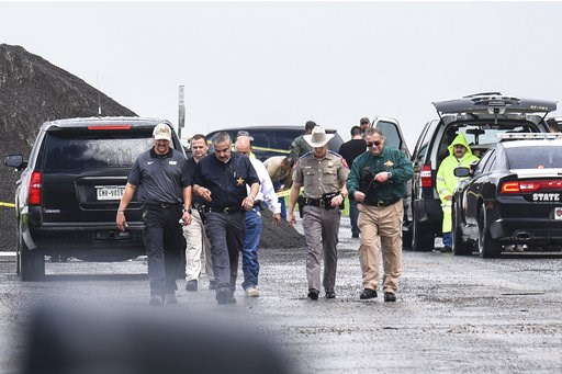 (Danny Zaragoza/The Laredo Morning Times via AP). Law enforcement officers gather near the scene where the body of a woman was found near Interstate 35 north of Laredo, Texas on Saturday, Sept. 15, 2018. A U.S. Border Patrol agent suspected of killing ... (Danny Zaragoza/The Laredo Morning Times via AP). Law enforcement officers gather near the scene where the body of a woman was found near Interstate 35 north of Laredo, Texas on Saturday, Sept. 15, 2018. A U.S. Border Patrol agent suspected of killing ...