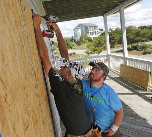 (AP Photo/Tom Copeland, File). FILE - In this Wednesday, Sept. 12, 2018 file photo, Joe Gore, left, and Joshua Adcock prepare for Hurricane Florence as they board up windows on a home in Emerald Isle N.C. Before and after a hurricane, Ace is the place.... (AP Photo/Tom Copeland, File). FILE - In this Wednesday, Sept. 12, 2018 file photo, Joe Gore, left, and Joshua Adcock prepare for Hurricane Florence as they board up windows on a home in Emerald Isle N.C. Before and after a hurricane, Ace is the place....