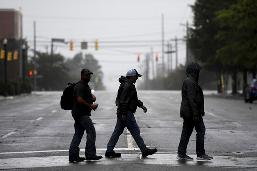 (AP Photo/Sean Rayford). People cross a downtown street in Columbia, S.C. as the remnants of Hurricane Florence slowly move across the East Coast Saturday, Sept. 15, 2018. (AP Photo/Sean Rayford). People cross a downtown street in Columbia, S.C. as the remnants of Hurricane Florence slowly move across the East Coast Saturday, Sept. 15, 2018.