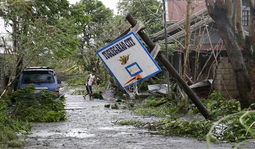 (AP Photo/Aaron Favila). A resident walks beside a toppled basketball court after Typhoon Mangkhut barreled across Tuguegarao city, Cagayan province, northeastern Philippines, Saturday, Sept. 15, 2018. Philippine officials were assessing damage and ch... (AP Photo/Aaron Favila). A resident walks beside a toppled basketball court after Typhoon Mangkhut barreled across Tuguegarao city, Cagayan province, northeastern Philippines, Saturday, Sept. 15, 2018. Philippine officials were assessing damage and ch...