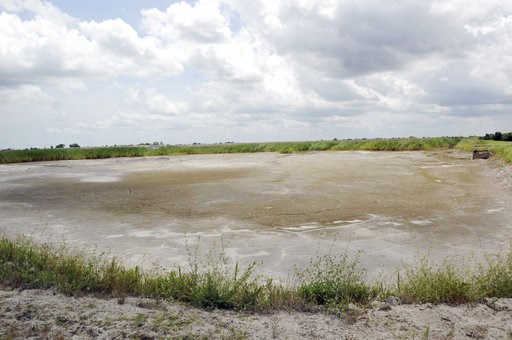 (Mike Spencer/The Star-News via AP). FILE - In this June 23, 2014 file photo, the dried-up bed of an inactive coal ash pond is seen at Duke Energy's Sutton plant in Wilmington, N.C. Duke Energy says heavy rains from Florence have caused a slope to coll... (Mike Spencer/The Star-News via AP). FILE - In this June 23, 2014 file photo, the dried-up bed of an inactive coal ash pond is seen at Duke Energy's Sutton plant in Wilmington, N.C. Duke Energy says heavy rains from Florence have caused a slope to coll...