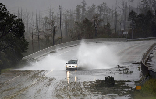 (Matt Born/The Star-News via AP). A car drives through water caused by the rain from Florence, now a tropical storm on U.S. 74/76 in Leland, N.C., Saturday, Sept.15, 2018. The rain from Hurricane Florence was expected to continue through Sunday. (Matt Born/The Star-News via AP). A car drives through water caused by the rain from Florence, now a tropical storm on U.S. 74/76 in Leland, N.C., Saturday, Sept.15, 2018. The rain from Hurricane Florence was expected to continue through Sunday.