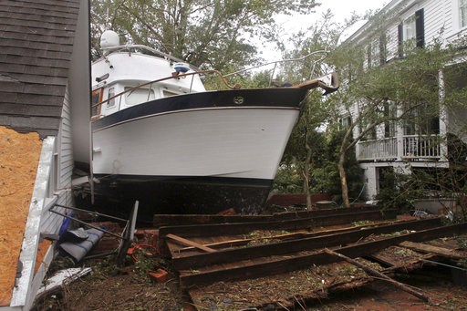 (Gray Whitley/Sun Journal via AP). A 40-foot yacht lies in the yard of a storm-damaged home on East Front Street in New Bern, N.C., Saturday, Sept. 15, 2018. The boat washed up with storm surge and debris from Hurricane Florence. (Gray Whitley/Sun Journal via AP). A 40-foot yacht lies in the yard of a storm-damaged home on East Front Street in New Bern, N.C., Saturday, Sept. 15, 2018. The boat washed up with storm surge and debris from Hurricane Florence.