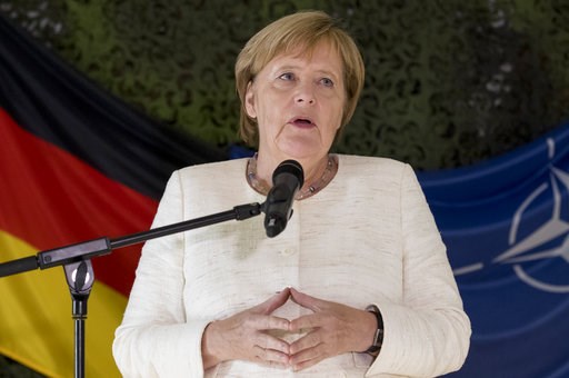 Top German spy awaits his fate as party leaders meet