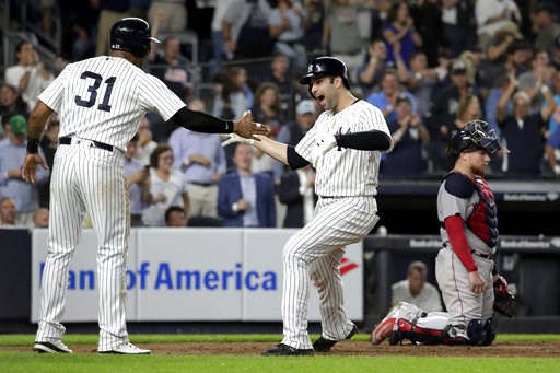 Walker wakes Yanks with HR, Boston's AL East bash waits
