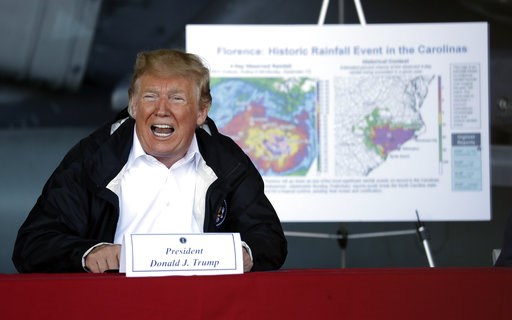 The Latest: Trump assures South Carolina as flooding lingers