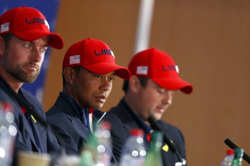 (AP Photo/Alastair Grant). US players Webb Simpson, left, Tiger Woods and Patrick Reed, right, attend the press conference of the losing team after Europe won the 2018 Ryder Cup golf tournament at Le Golf National in Saint Quentin-en-Yvelines, outside ... (AP Photo/Alastair Grant). US players Webb Simpson, left, Tiger Woods and Patrick Reed, right, attend the press conference of the losing team after Europe won the 2018 Ryder Cup golf tournament at Le Golf National in Saint Quentin-en-Yvelines, outside ...