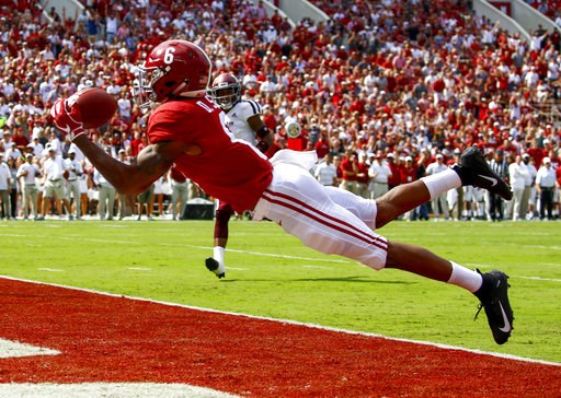 (AP Photo/Butch Dill, File). FILE - In this Sept. 22, 2018, file photo, Alabama wide receiver DeVonta Smith (6) catches a pass for a touchdown during the first half of an NCAA college football game against Texas A&M, in Tuscaloosa, Ala. No. 1 Alab... (AP Photo/Butch Dill, File). FILE - In this Sept. 22, 2018, file photo, Alabama wide receiver DeVonta Smith (6) catches a pass for a touchdown during the first half of an NCAA college football game against Texas A&M, in Tuscaloosa, Ala. No. 1 Alab...