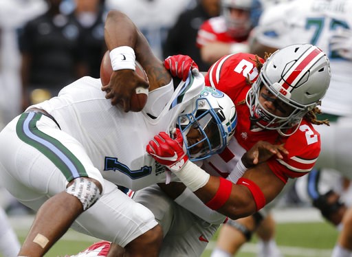 (AP Photo/Jay LaPrete, File). FILE - In this Sept. 22, 2018, file photo, Ohio State defensive end Chase Young, right, sacks Tulane quarterback Jonathan Banks during the first half of an NCAA college football game, in Columbus, Ohio.n Indiana plays at O... (AP Photo/Jay LaPrete, File). FILE - In this Sept. 22, 2018, file photo, Ohio State defensive end Chase Young, right, sacks Tulane quarterback Jonathan Banks during the first half of an NCAA college football game, in Columbus, Ohio.n Indiana plays at O...