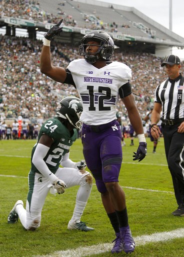 (AP Photo/Al Goldis). Northwestern's JJ Jefferson (12) celebrates his touchdown reception against Michigan State's Tre Person (24) during the second quarter of an NCAA college football game, Saturday, Oct. 6, 2018, in East Lansing, Mich. (AP Photo/Al Goldis). Northwestern's JJ Jefferson (12) celebrates his touchdown reception against Michigan State's Tre Person (24) during the second quarter of an NCAA college football game, Saturday, Oct. 6, 2018, in East Lansing, Mich.