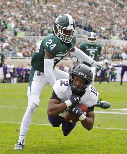 (AP Photo/Al Goldis). Northwestern's JJ Jefferson (12) catches a pass for a touchdown against Michigan State's Tre Person (24) during the second quarter of an NCAA college football game, Saturday, Oct. 6, 2018, in East Lansing, Mich. (AP Photo/Al Goldis). Northwestern's JJ Jefferson (12) catches a pass for a touchdown against Michigan State's Tre Person (24) during the second quarter of an NCAA college football game, Saturday, Oct. 6, 2018, in East Lansing, Mich.
