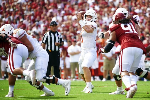 (AP Photo/Cooper Neill). Texas quarterback Sam Ehlinger (11) drops back to pass against Oklahoma during the first half of an NCAA college football game at the Cotton Bowl, Saturday, Oct. 6, 2018, in Dallas. (AP Photo/Cooper Neill). Texas quarterback Sam Ehlinger (11) drops back to pass against Oklahoma during the first half of an NCAA college football game at the Cotton Bowl, Saturday, Oct. 6, 2018, in Dallas.