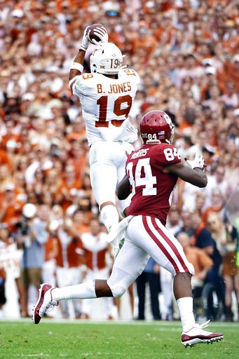 (AP Photo/Cooper Neill). Texas defensive back Brandon Jones (19) intercepts a pass thrown by Oklahoma quarterback Kyler Murray (1) during the first half of an NCAA college football game at the Cotton Bowl, Saturday, Oct. 6, 2018, in Dallas. (AP Photo/Cooper Neill). Texas defensive back Brandon Jones (19) intercepts a pass thrown by Oklahoma quarterback Kyler Murray (1) during the first half of an NCAA college football game at the Cotton Bowl, Saturday, Oct. 6, 2018, in Dallas.