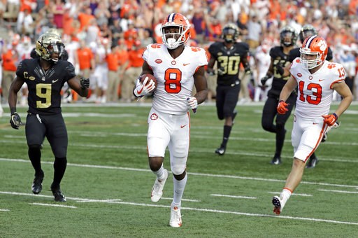 (AP Photo/Chuck Burton). Clemson's Justyn Ross (8) runs past Wake Forest's Chuck Wade Jr. (9) for a touchdown during the first half of an NCAA college football game in Charlotte, N.C., Saturday, Oct. 6, 2018. (AP Photo/Chuck Burton). Clemson's Justyn Ross (8) runs past Wake Forest's Chuck Wade Jr. (9) for a touchdown during the first half of an NCAA college football game in Charlotte, N.C., Saturday, Oct. 6, 2018.