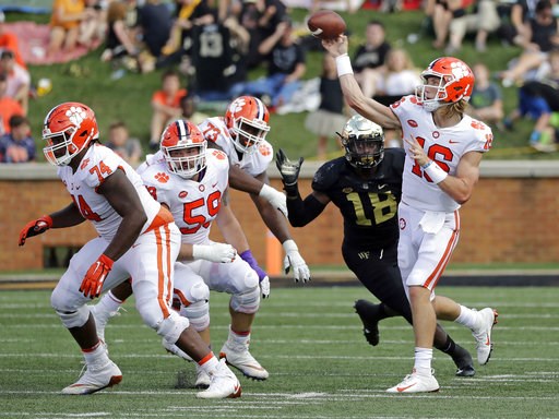 (AP Photo/Chuck Burton). Clemson's Trevor Lawrence (16) throws a pass against Wake Forest during the first half of an NCAA college football game in Charlotte, N.C., Saturday, Oct. 6, 2018. (AP Photo/Chuck Burton). Clemson's Trevor Lawrence (16) throws a pass against Wake Forest during the first half of an NCAA college football game in Charlotte, N.C., Saturday, Oct. 6, 2018.