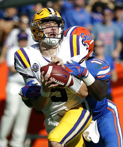 (AP Photo/John Raoux). LSU quarterback Joe Burrow, left, is sacked by Florida linebacker Vosean Joseph during the first half of an NCAA college football game, Saturday, Oct. 6, 2018, in Gainesville, Fla. (AP Photo/John Raoux). LSU quarterback Joe Burrow, left, is sacked by Florida linebacker Vosean Joseph during the first half of an NCAA college football game, Saturday, Oct. 6, 2018, in Gainesville, Fla.
