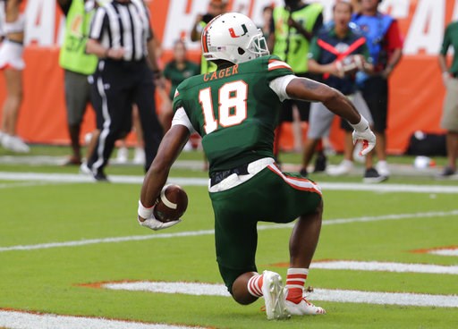(AP Photo/Lynne Sladky). Miami wide receiver Lawrence Cager (18) scores a touchdown during the first half of an NCAA college football game against Florida State, Saturday, Oct. 6, 2018, in Miami Gardens, Fla. (AP Photo/Lynne Sladky). Miami wide receiver Lawrence Cager (18) scores a touchdown during the first half of an NCAA college football game against Florida State, Saturday, Oct. 6, 2018, in Miami Gardens, Fla.