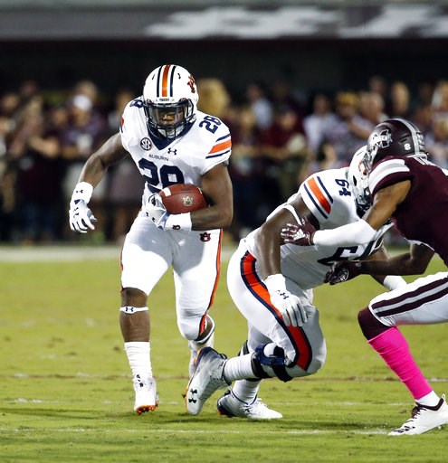 (AP Photo/Rogelio V. Solis). Auburn running back JaTarvious Whitlow (28) picks up yards against Mississippi State during the first half of their NCAA college football game in Starkville, Miss., Saturday, Oct. 6 2018. (AP Photo/Rogelio V. Solis). Auburn running back JaTarvious Whitlow (28) picks up yards against Mississippi State during the first half of their NCAA college football game in Starkville, Miss., Saturday, Oct. 6 2018.