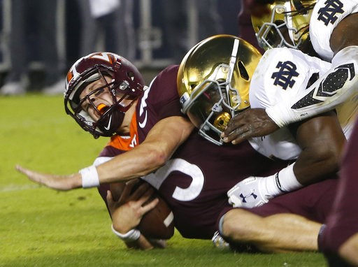 (AP Photo/Steve Helber). Virginia Tech quarterback Ryan Willis (5) is slammed to the ground on third down near the goal line during the first half of an NCAA college football game in Blacksburg, Va., Saturday, Oct. 6, 2018. (AP Photo/Steve Helber). Virginia Tech quarterback Ryan Willis (5) is slammed to the ground on third down near the goal line during the first half of an NCAA college football game in Blacksburg, Va., Saturday, Oct. 6, 2018.