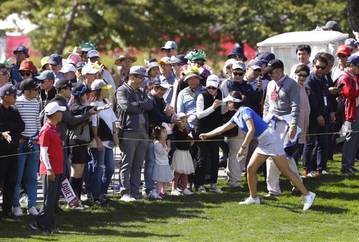 (AP Photo/Ahn Young-joon). In Gee Chun of South Korea is greeted by the gallery on the sixth hole during the final round of the LPGA's UL International Crown golf tournament at the Jack Nicklaus Golf Club Korea in Incheon, South Korea, Sunday, Oct. 7, ... (AP Photo/Ahn Young-joon). In Gee Chun of South Korea is greeted by the gallery on the sixth hole during the final round of the LPGA's UL International Crown golf tournament at the Jack Nicklaus Golf Club Korea in Incheon, South Korea, Sunday, Oct. 7, ...